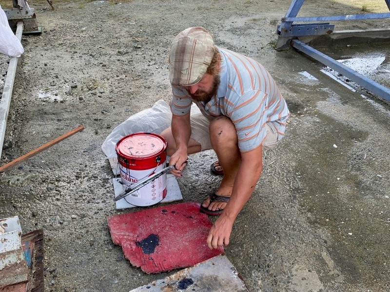 Preparing our sailboat - Anti fouling paint in Raiatea French Polynesia