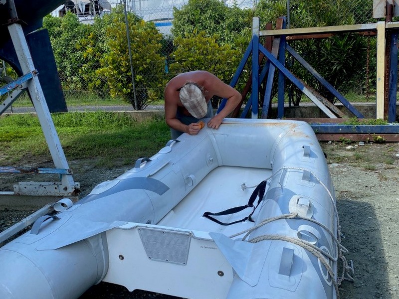Preparing our sailboat - a patch for the dingy in Raiatea French Polynesia