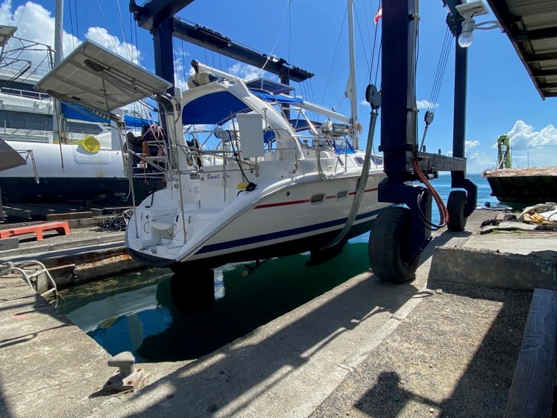 The travel liftputs our sailboat back into the water in Raiatea Carenage
