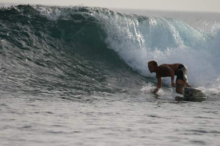 Lionel from Sail Tahiti surfing the reef spots in Polynesia
