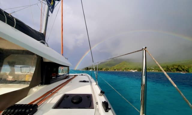 Cruising weather forecast Tahiti Rainbow over Excess 11 catamaran Moorea